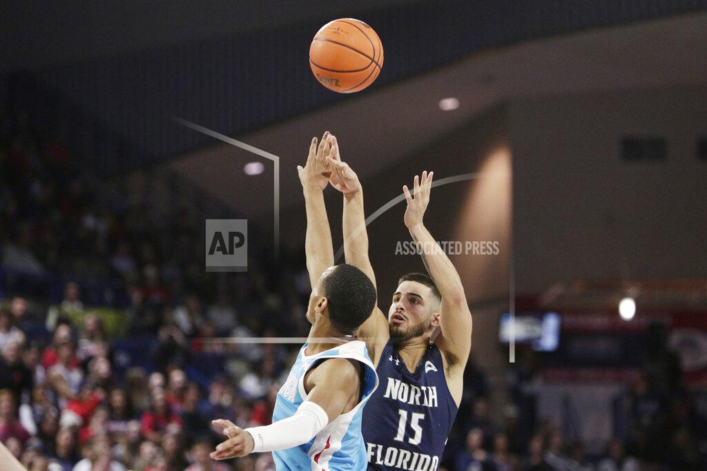 Young Kwak North Florida guard Jose Placer, right, shoots while defended by Gonzaga guard Nolan Hickman during the second half of an NCAA college basketball game, Monday, Nov. 7, 2022, in Spokane, Wash. Gonzaga won 104-63. (AP Photo/Young Kwak)