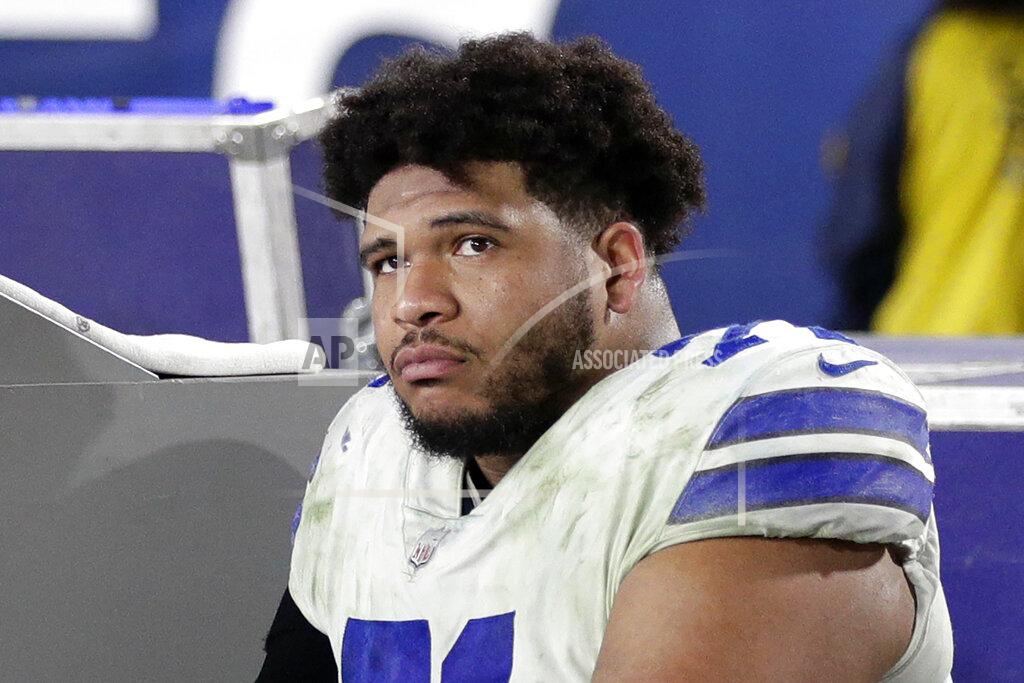 Jae C. Hong FILE - In this Jan. 12, 2019, file photo, Dallas Cowboys tackle La'el Collins sits on the bench during the second half in an NFL divisional football playoff game against the Los Angeles Rams, in Los Angeles. The Dallas Cowboys and right tackle La’el Collins have agreed on a new contract, the second extension to get settled during star running back Ezekiel Elliott’s holdout. The deal signed Tuesday, Sept. 2, 2019, is the second extension Collins and the Cowboys have negotiated since he chose them as an undrafted free agent in 2015. (AP Photo/Jae C. Hong, File)