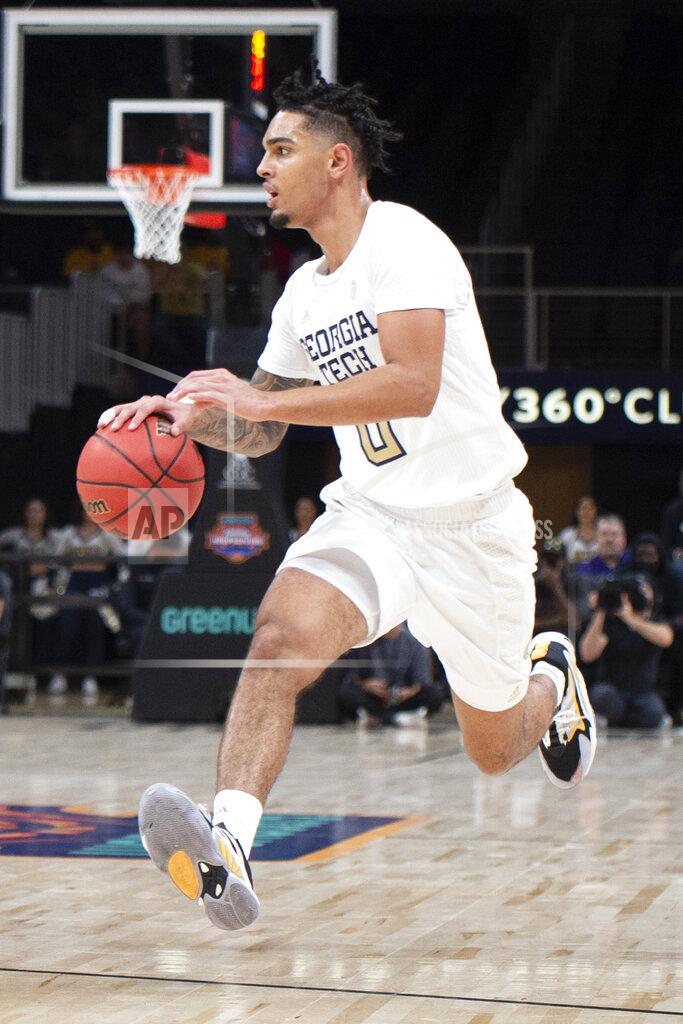Hakim Wright Sr. Georgia Tech guard Michael Devoe drives during the first half of the team's NCAA college basketball game against LSU on Saturday, Dec. 11, 2021, in Atlanta. (AP Photo/Hakim Wright Sr.)