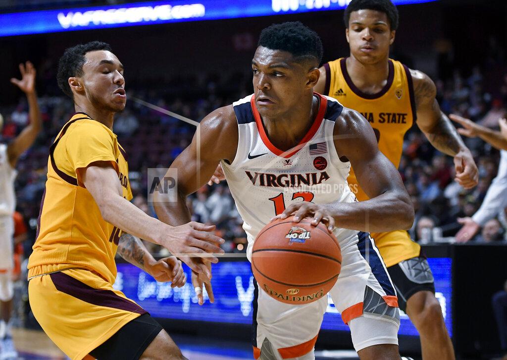 Jessica Hill Virginia's Casey Morsell, right, dribbles around Arizona State's Jaelen House, left, during the second half of an NCAA college basketball game, Sunday, Nov. 24, 2019, in Uncasville, Conn. (AP Photo/Jessica Hill)