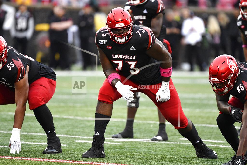 Timothy D. Easley FILE - In this Oct. 26, 2019, file photo, Louisville offensive lineman Mekhi Becton (73) lines up during the first half of the team's NCAA college football game against Virginia in Louisville, Ky. New York GM Joe Douglas promised quarterback Sam Darnold’s parents last summer he’d add playmakers and offensive line protectors for their son -- and he certainly gave it a shot. The Jets drafted massive Louisville offensive tackle Mekhi Becton with the No. 11 overall pick and took Baylor speedy wide receiver Denzel Mims in the second round. (AP Photo/Timothy D. Easley, File)