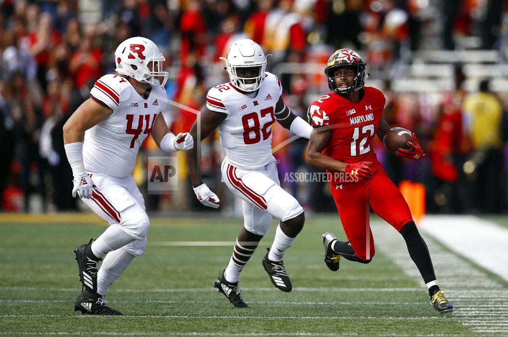 Patrick Semansky Maryland punt returner Taivon Jacobs, right, rushes past Rutgers defenders Max Anthony, left, and Zihir Lacewell in the first half of an NCAA college football game, Saturday, Oct. 13, 2018, in College Park, Md. (AP Photo/Patrick Semansky)