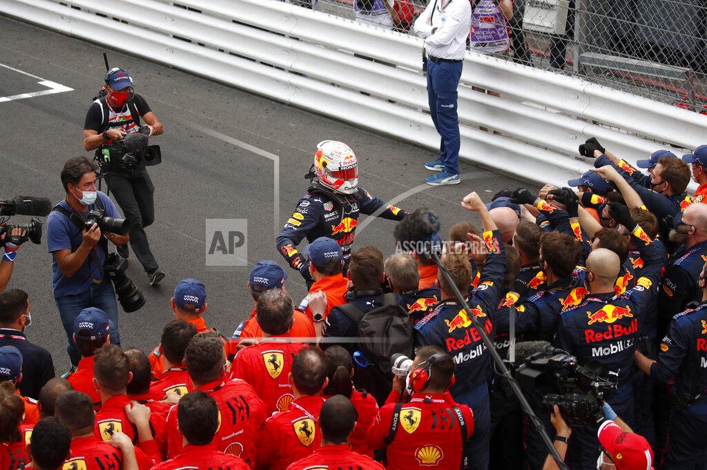 Gonzalo Fuentes Red Bull driver Max Verstappen of the Netherlands, center, is congratulated by teammates after winning the Monaco Grand Prix at the Monaco racetrack, in Monaco, Sunday, May 23, 2021. (Gonzalo Fuentes, Pool via AP)
