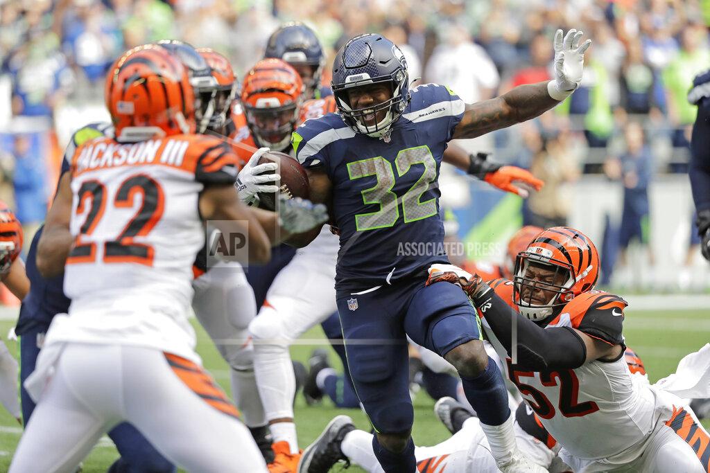 John Froschauer Seattle Seahawks running back Chris Carson (32) rushes against the Cincinnati Bengals during the second half of an NFL football game, Sunday, Sept. 8, 2019, in Seattle. (AP Photo/John Froschauer)