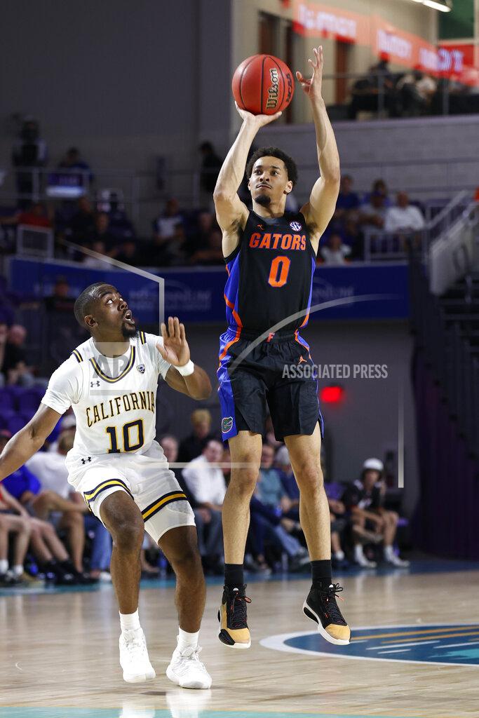 Scott Audette Florida guard Myreon Jones (0) shoots over California guard Makale Foreman (10) during the first half of an NCAA college basketball game Monday, Nov. 22, 2021, in Fort Myers, Fla. (AP Photo/Scott Audette)