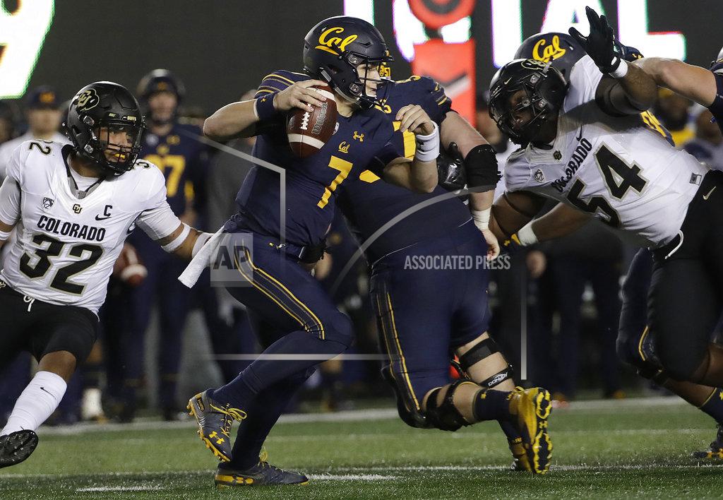 Jeff Chiu California quarterback Chase Garbers (7) scrambles away from Colorado linebacker Rick Gamboa (32) and defensive end Terrance Lang (54) during the second half of an NCAA college football game in Berkeley, Calif., Saturday, Nov. 24, 2018. California won, 33-21. (AP Photo/Jeff Chiu)