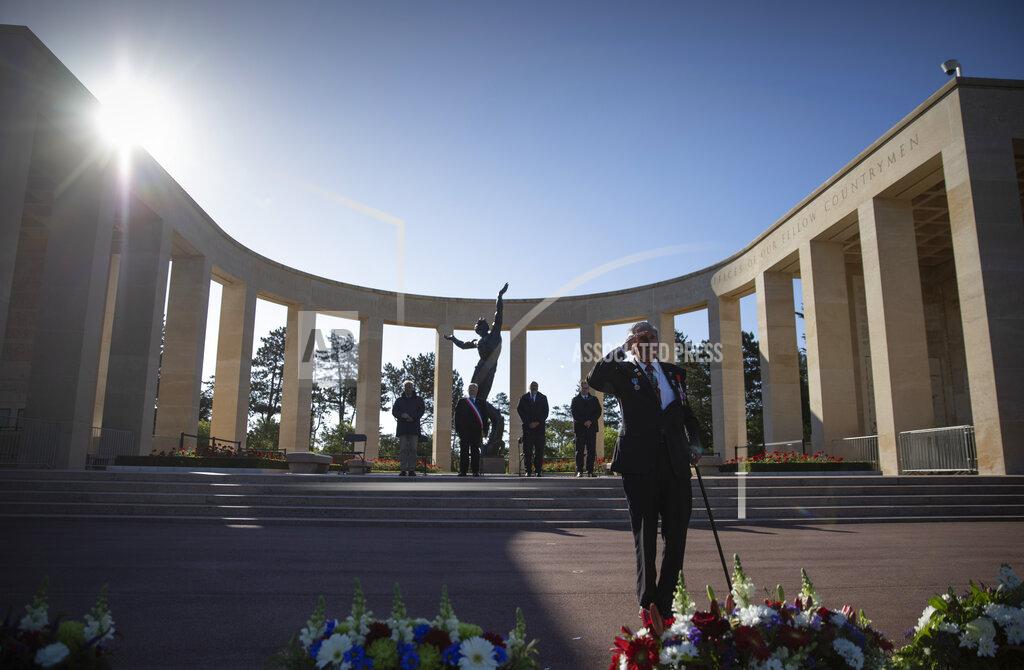 Virginia Mayo Charles Norman Shay, D-Day WWII veteran and Penobscot Elder from Maine, salutes after laying a wreath during a D-Day 76th anniversary ceremony at the Normandy American Cemetery in Colleville-sur-Mer, Normandy, France, Saturday, June 6, 2020. Due to coronavirus measures many ceremonies and memorials have been cancelled in the region with the exception of very small gatherings. (AP Photo/Virginia Mayo)