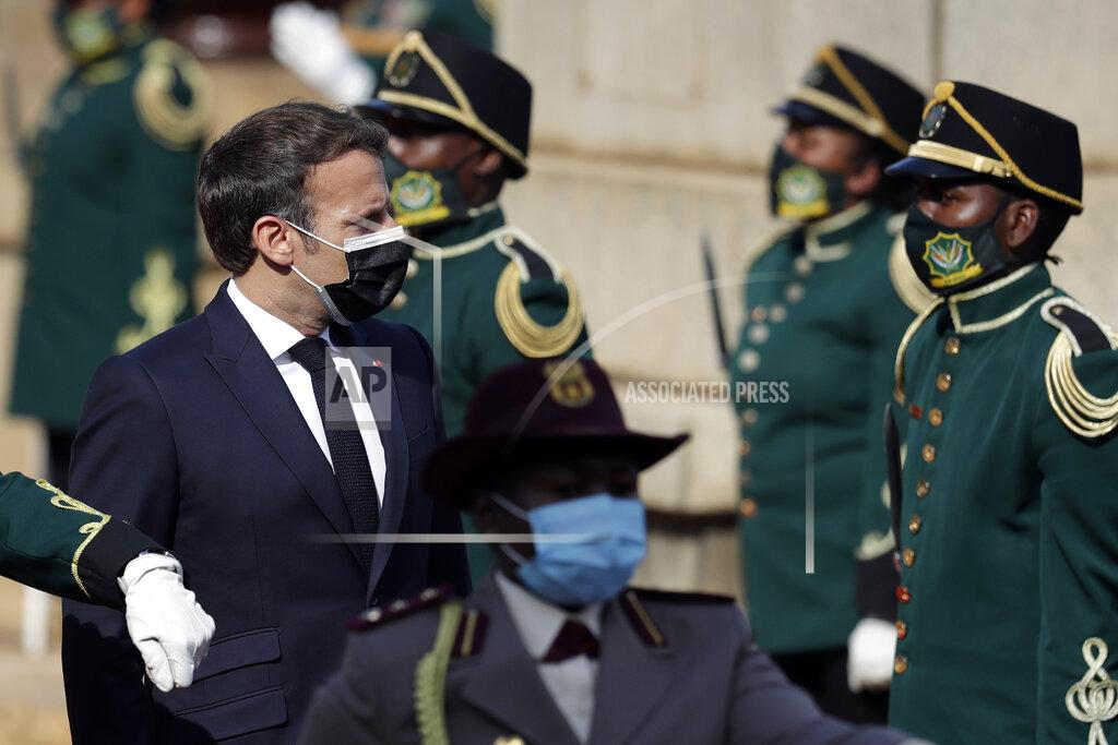 Themba Hadebe French President Emmanuel Macron reviews the honour guard during a welcoming ceremony at the government's Union Buildings, in Pretoria, South Africa, Friday, May 28, 2021. Macron is on a two-day official visit to the country. (AP Photo/Themba Hadebe, Pool)