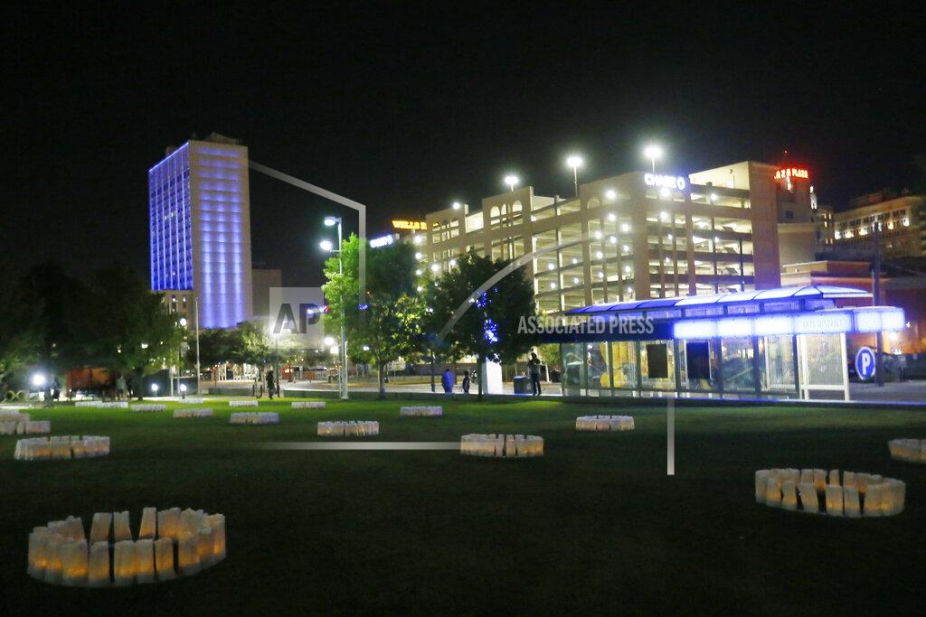 Briana Sanchez In this Thursday, July 30, 2020 photo, luminarias are arranged in Cleveland Square Park honoring the victims of the Aug. 3, 2019 El Paso shooting in downtown El Paso, Texas. (Briana Sanchez/The El Paso Times via AP)