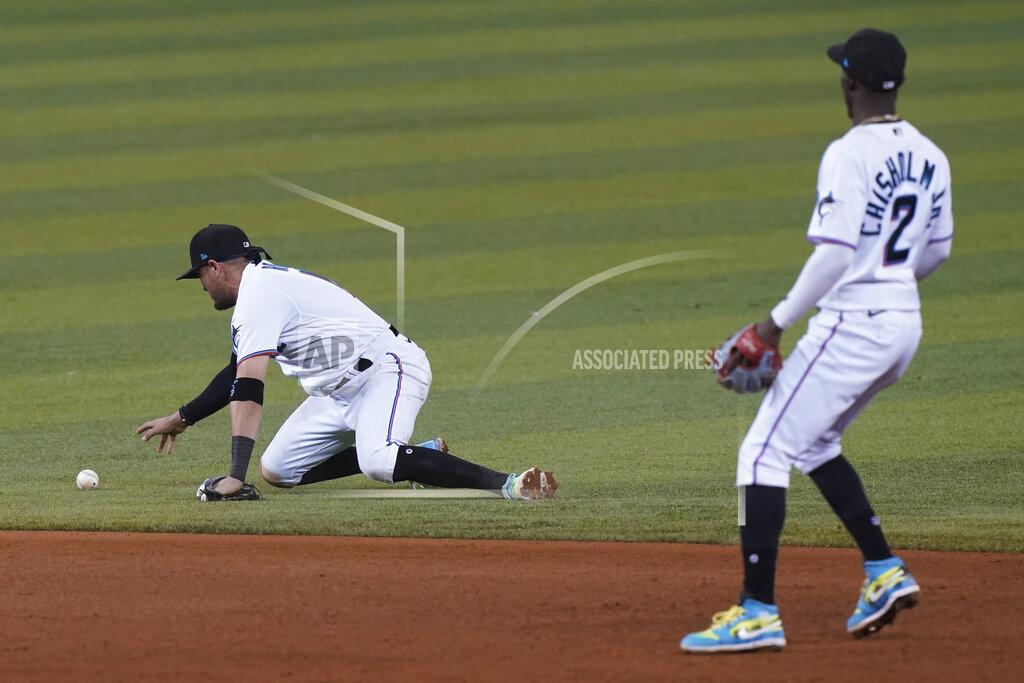 Marta Lavandier Miami Marlins shortstop Miguel Rojas (19) reaches for the ball after dropping the catch on a hit by Washington Nationals Luis Garcia during the sixth inning of a baseball game, Tuesday, Sept. 21, 2021, in Miami. To the right is Miami Marlins' second baseman Jazz Chisholm Jr. (2). (AP Photo/Marta Lavandier)
