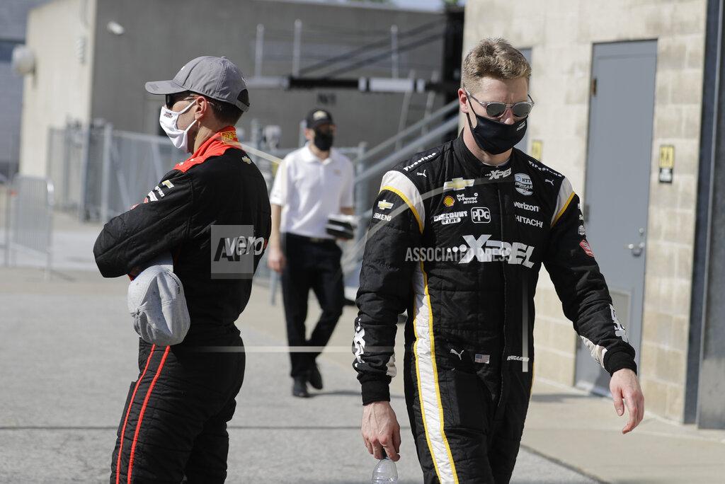 Darron Cummings Josef Newgarden, right, walks past Will Power, of Australia, after Power won the pole for the IndyCar auto race at Indianapolis Motor Speedway in Indianapolis, Friday, July 3, 2020. (AP Photo/Darron Cummings)