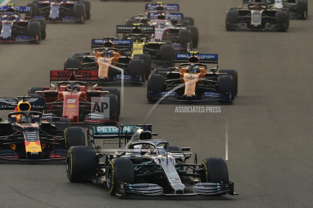Hassan Ammar Mercedes driver Lewis Hamilton of Britain leads during the Emirates Formula One Grand Prix, at the Yas Marina racetrack in Abu Dhabi, United Arab Emirates, Sunday, Dec.1, 2019. (AP Photo/Hassan Ammar)