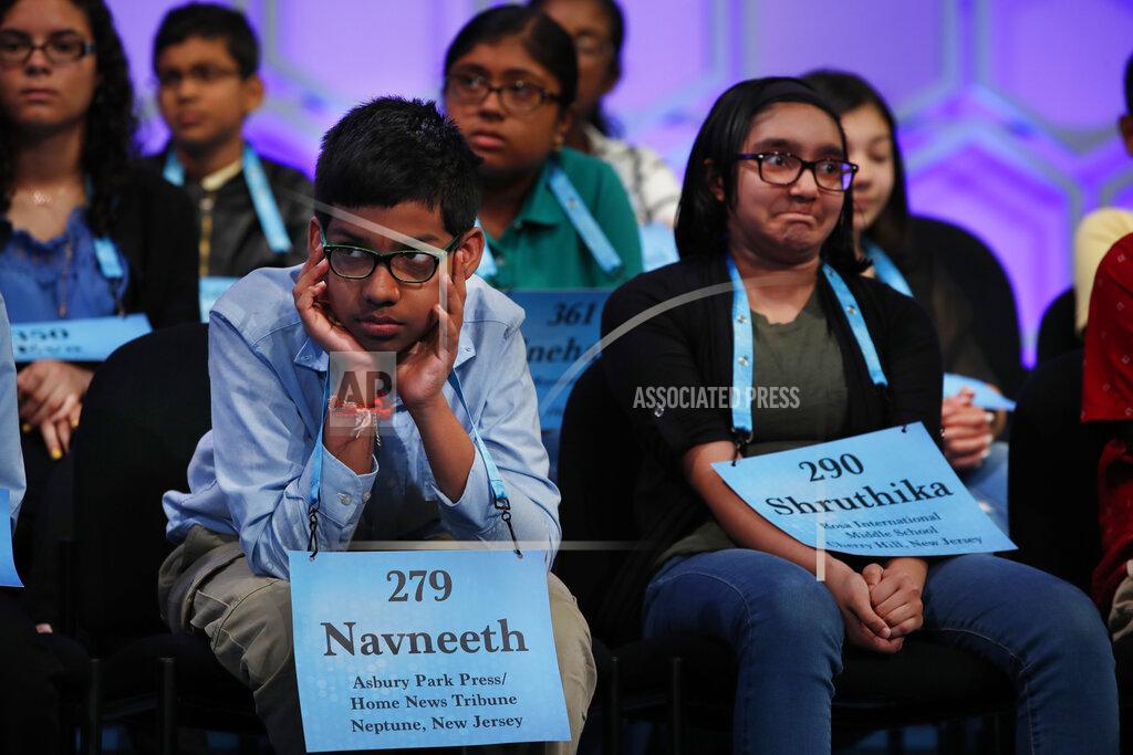Jacquelyn Martin FILE - In this May 31, 2018 file photo, Navneeth Murali, 12, from Edison, N.J., left, and Shruthika Padhy, 12, from Cherry Hill, N.J., reacts during competition in the Scripps National Spelling Bee in Oxon Hill, Md., With the 2020 Scripps National Spelling Bee canceled because the coronavirus pandemic, an online spelling bee launched by two Texas teenagers is offering a consolation prize of sorts, with competitors nationwide including many of the kids who were considered favorites for the Scripps title. (AP Photo/Jacquelyn Martin, File)