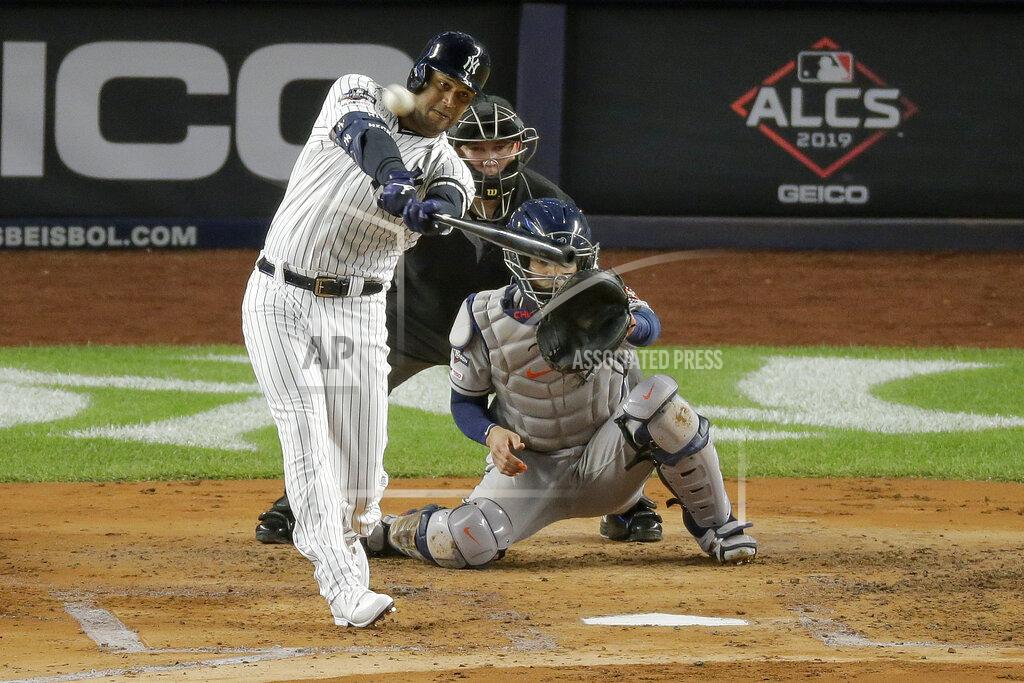 Seth Wenig FILE - In this Oct. 18, 2019, file photo, New York Yankees' Aaron Hicks connects for a three-run home run against the Houston Astros during the first inning of Game 5 of baseball's American League Championship Series, in New York. Nothing changes the New York Yankees' mission, not the novel coronavirus, not a 60-game regular season. Winning the World Series is the sole focus. (AP Photo/Seth Wenig, File)