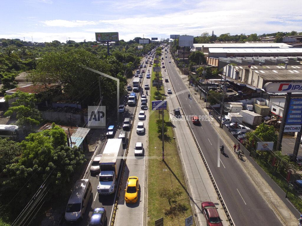 Salvador Melendez Vehicles circulate on Army Boulevard, on the second day of the reopening of the economy, three-months after a lockdown aimed at preventing the spread of the new coronavirus in Soyapango, El Salvador, Tuesday, June 16, 2020. The Legislative Assembly passed legislation early Friday that would extend a state of emergency in the country for another two weeks, but eliminate the nearly universal mandatory stay-at-home order except for those who tested positive for COVID-19 and those returning from abroad. (AP Photo/Salvador Melendez)