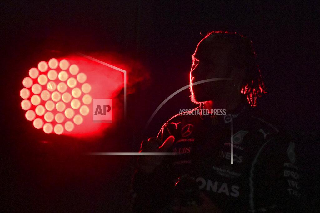 Andrej Isakovic Mercedes driver Lewis Hamilton of Britain arrives at the podium after winning the Formula One Saudi Arabian Grand Prix in Jiddah, Sunday, Dec. 5, 2021. (Andrej Isakovic, Pool Photo via AP)