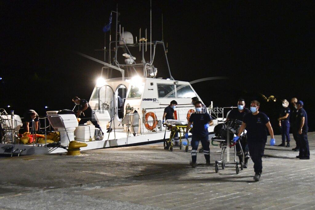 Michael Svarnias A coast guard vessel arrives with two bodies at Pythagorio port, on the eastern Aegean island of Samos, Greece, late Monday, Sept. 13, 2021. Authorities in Greece Tuesday opened an investigation into the crash of a private plane from Israel that killed a prosecution witness in the corruption trial of former Israeli prime minister Benjamin Netanyahu. Haim Geron, a former senior official at Israel's ministry of communications, and his wife Esther were killed in the crash late Monday off the island of Samos. (AP Photo/Michael Svarnias)
