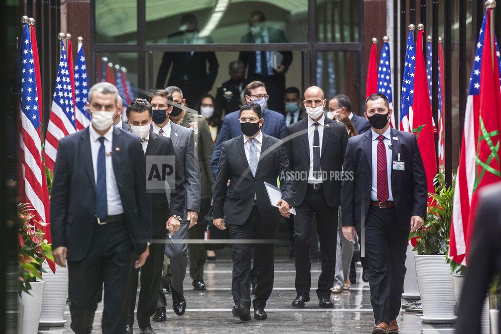 Mosa'ab Elshamy U.S Secretary of Defense Mark Esper, left, and Moroccan Foreign Minister Nasser Bourita, right, walk together during the former's visit to Rabat, Morocco, Friday, Oct. 2, 2020. The visit is part of U.S. Defense Secretary Mark Esper's North Africa tour and is his first visit to Africa as defense secretary. (AP Photo/Mosa'ab Elshamy)