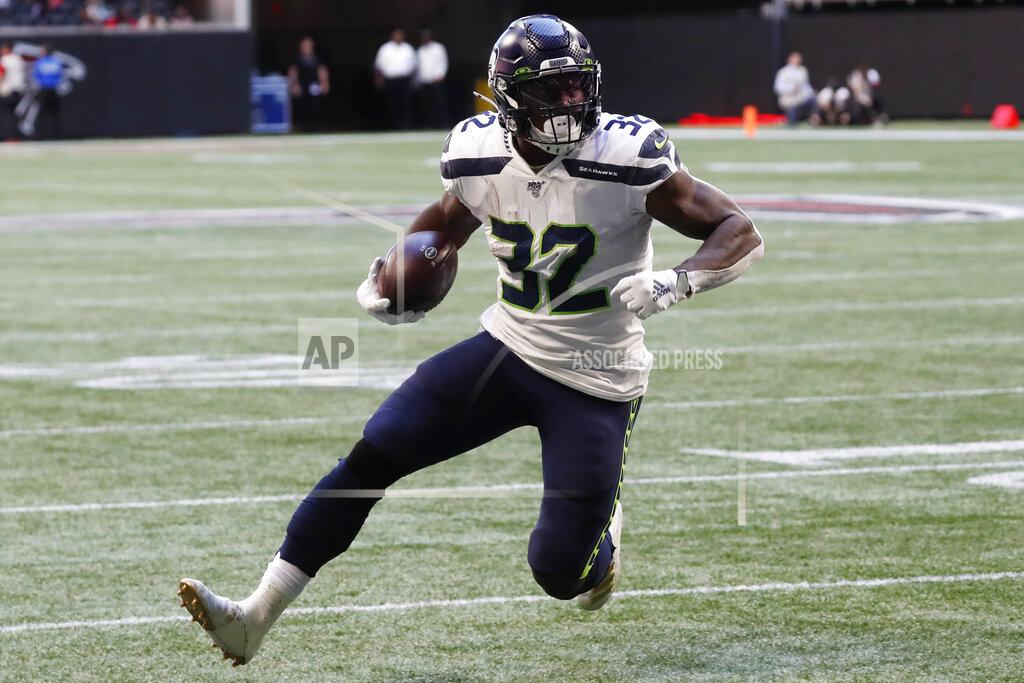 John Bazemore Seattle Seahawks running back Chris Carson (32) runs into the end zone for a touchdown against the Atlanta Falcons during the first half of an NFL football game, Sunday, Oct. 27, 2019, in Atlanta. (AP Photo/John Bazemore)