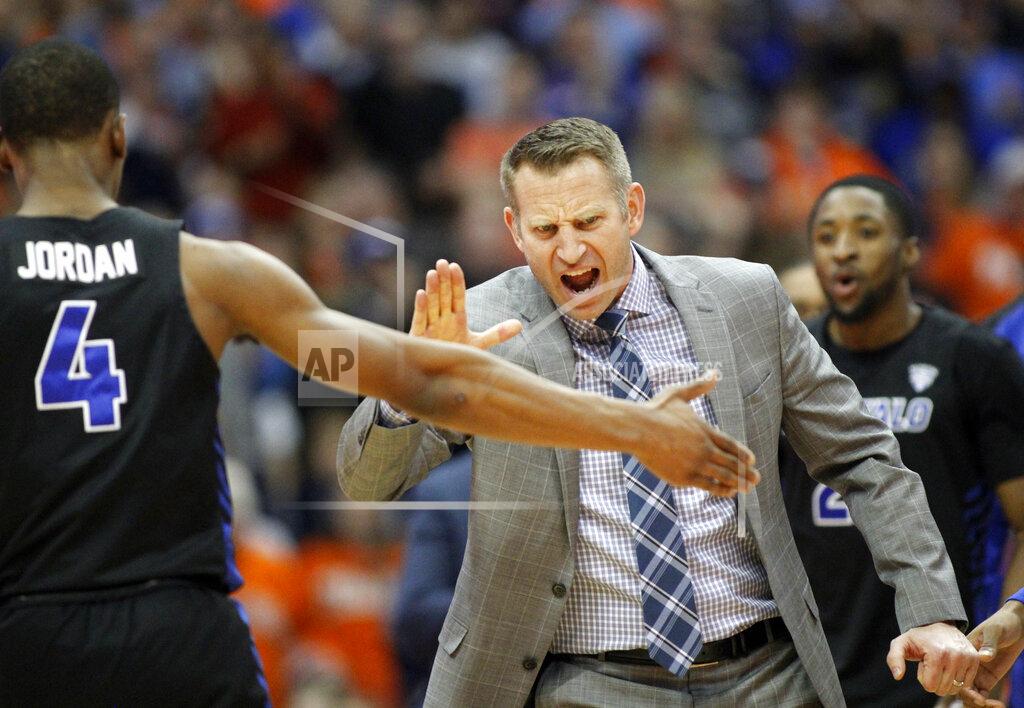 Nick Lisi FILE - In this Tuesday, Dec. 18, 2018, file photo, Buffalo head coach Nate Oats celebrates with Buffalo's Davonta Jordan (4) late in the second half of an NCAA college basketball game against Syracuse in Syracuse, N.Y. Oats’ fearless and unfiltered approach to basketball has Buffalo off to its best start in school history, and in position to secure their fourth NCAA Tournament berth in five years. (AP Photo/Nick Lisi, File)