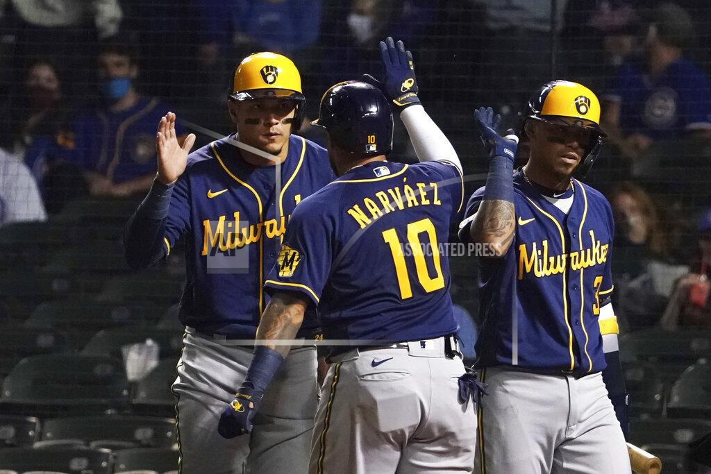 David Banks Milwaukee Brewers' Omar Narvaez (10) is greeted after hitting a three-run home run against the Chicago Cubs during the seventh inning of a baseball game, Monday, April 5, 2021, in Chicago. (AP Photo/David Banks)