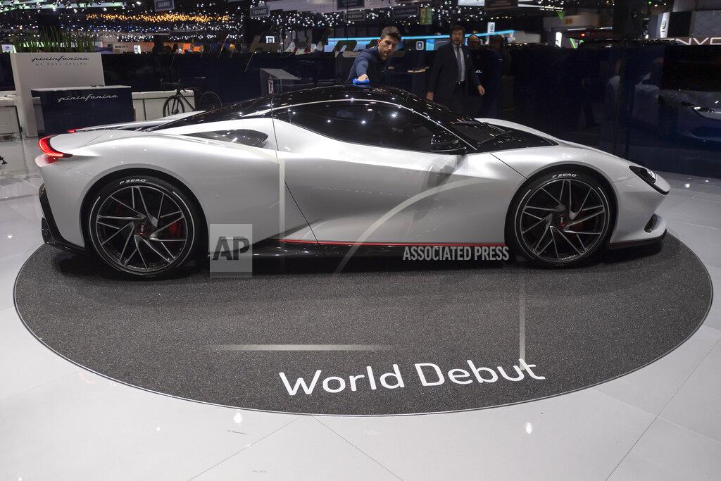 Martial Trezzini The Pininfarina Battista is presented during the press day at the '89th Geneva International Motor Show' in Geneva, Switzerland, Tuesday, March 5, 2019. The 'Geneva International Motor Show' takes place in Switzerland from March 7 until March 17, 2019. Automakers are rolling out new electric and hybrid models at the show as they get ready to meet tougher emissions requirements in Europe - while not forgetting the profitable and popular SUVs and SUV-like crossovers. (Martial Trezzini/Keystone via AP)