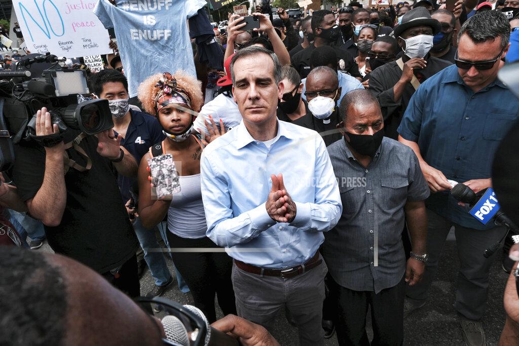 Richard Vogel FILE - In this June 2, 2020, file photo, Los Angeles Mayor Eric Garcetti arrives to appeal to Black Lives Matter protesters in downtown Los Angeles. Garcetti has taken his name out of consideration for a possible post in the Biden administration. (AP Photo/Richard Vogel, File)