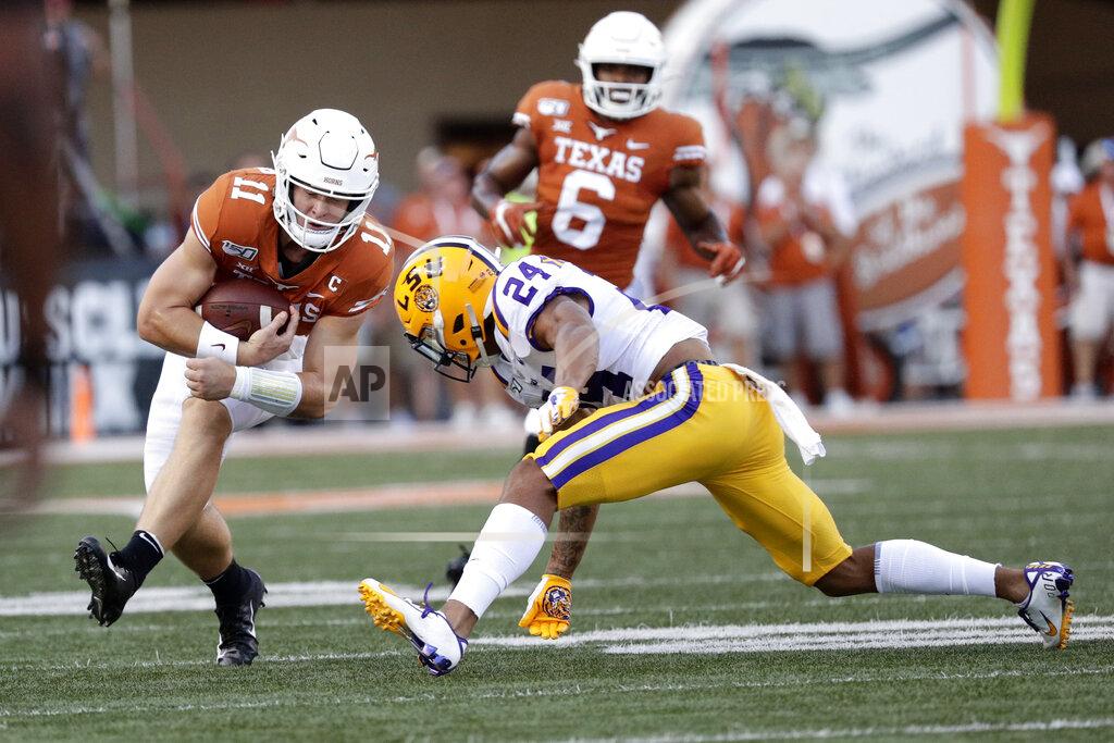Eric Gay Texas quarterback Sam Ehlinger (11) runs from LSU cornerback Derek Stingley Jr. (24) during the first half of an NCAA college football game Saturday, Sept. 7, 2019, in Austin, Texas. (AP Photo/Eric Gay)