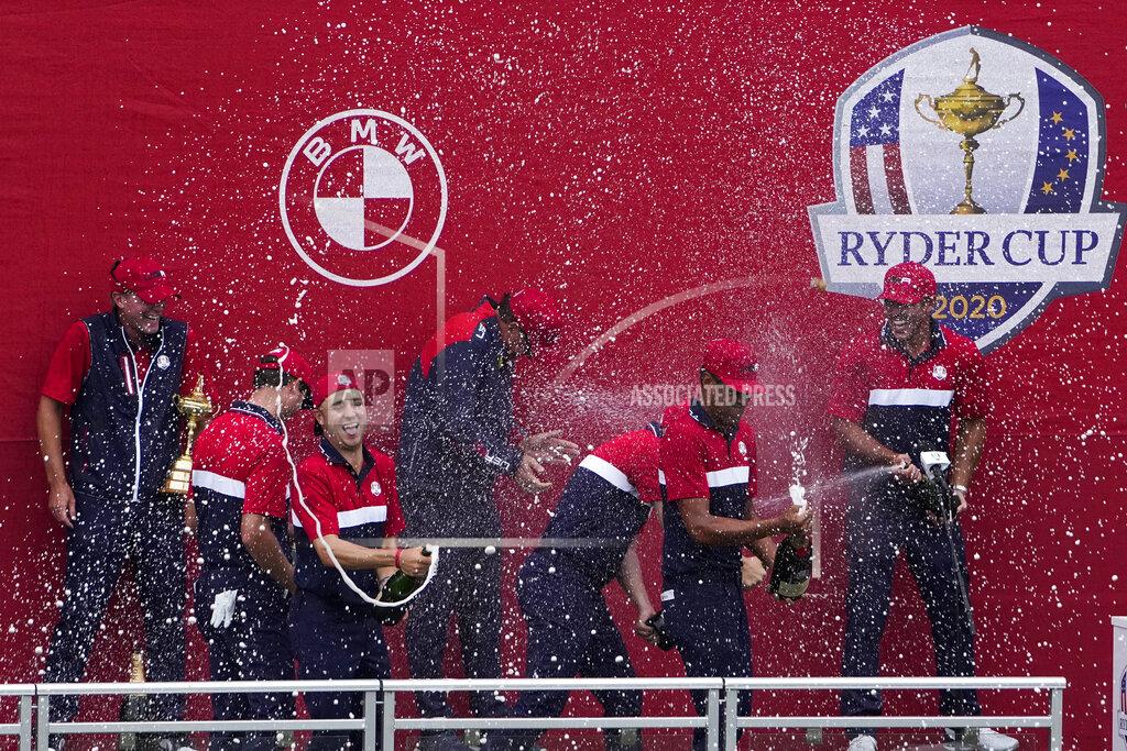 Jeff Roberson Team USA celebrates at the closing ceremony after winning the Ryder Cup at the Whistling Straits Golf Course Sunday, Sept. 26, 2021, in Sheboygan, Wis. (AP Photo/Jeff Roberson)