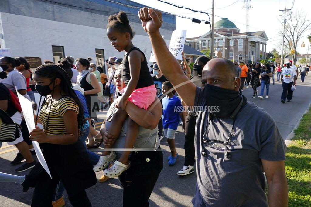 Steve Helber Protesters march along the streets to protest the shooting of Andrew Brown Jr. in Elizabeth City, N.C., Wednesday, April 28, 2021. A judge has denied requests to release body camera video in the case of Brown, a Black man who was killed by North Carolina deputies. (AP Photo/Steve Helber)