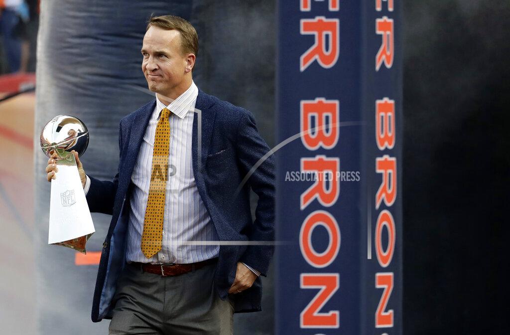 Jack Dempsey FILE - Former Denver Broncos quarterback Peyton Manning carries the Vince Lombardi Trophy from Super Bowl 50 onto the field prior to an NFL football game against the Carolina Panthers on Sept. 8, 2016, in Denver. Manning will be honored by the Broncos on Sunday, Oct. 31, 2021, during pregame and halftime ceremonies for his inductions into the Pro Football Hall of Fame and the Broncos' Ring of Fame. (AP Photo/Jack Dempsey, File)