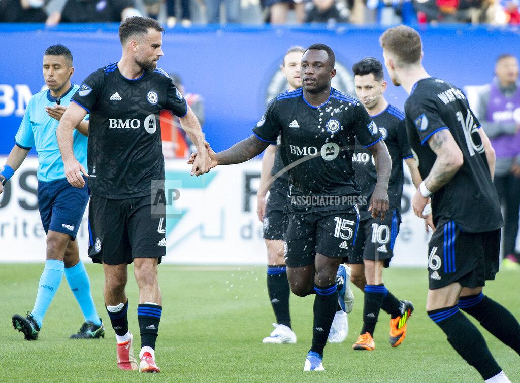 Graham Hughes CF Montreal players celebrate a goal by Zachary Brault-Guillard (15) against Orlando City during the second half of an MLS soccer game in Montreal, Saturday, May 7, 2022. (Graham Hughes/The Canadian Press via AP)