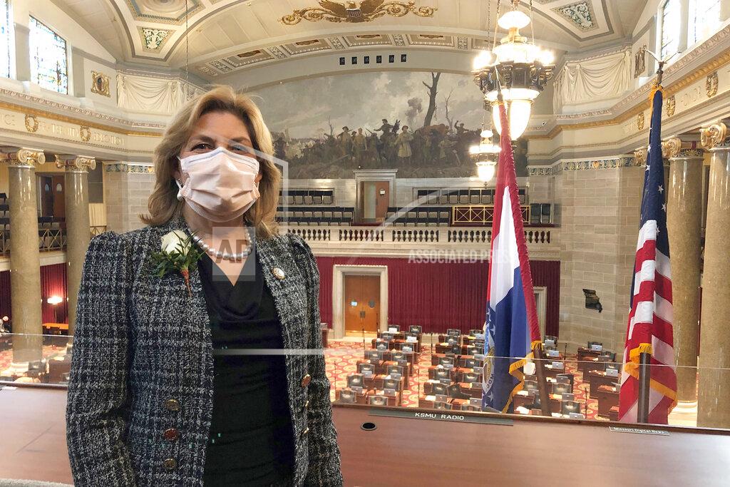 David A. Lieb Missouri state Rep. Brenda Shields stands in a gallery overlooking the Missouri House chamber on the opening day of the legislative session, Wednesday, Jan. 6, 2021, in Jefferson City, Missouri. Shields said she tested positive for COVID-19 in November, around the time the House last meet in session. She is encouraging colleagues to wear masks and take precautions. (AP Photo/David A. Lieb)