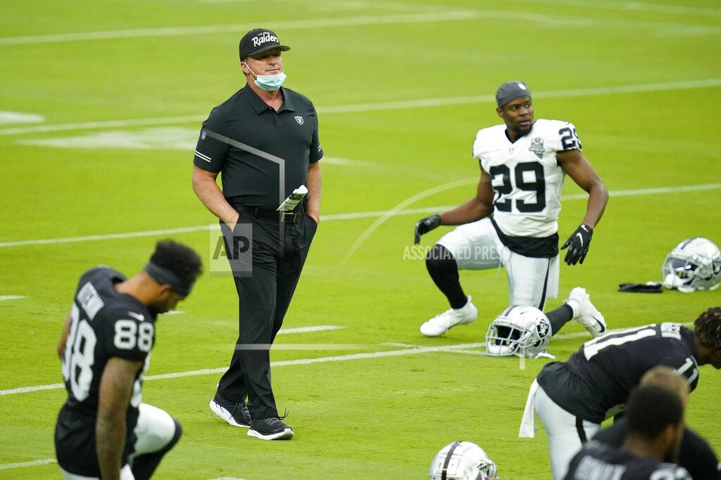 John Locher Las Vegas Raiders head coach Jon Gruden walks across the field during an NFL football training camp practice Friday, Aug. 21, 2020, in Las Vegas. (AP Photo/John Locher)
