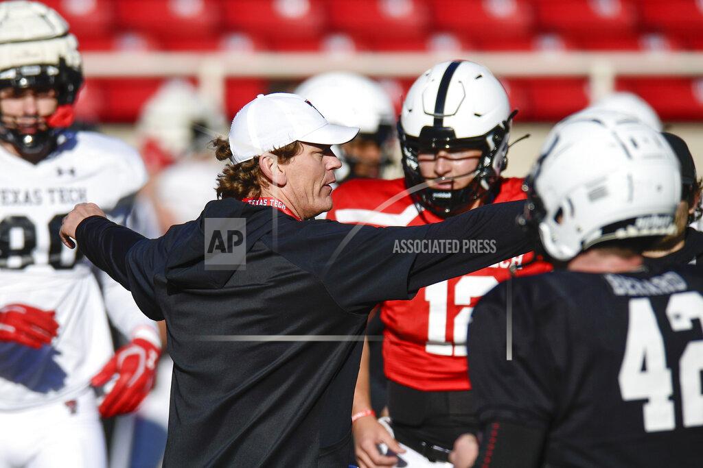 Justin Rex Texas Tech offensive coordinator Sonny Cumbie talks with players during an NCAA college football practice Saturday, March 27, 2021, in Lubbock, Texas. Cumbie will make his debut as interim coach Saturday, Oct. 30, 2021, following the firing of coach Matt Wells. (Justin Rex/Lubbock Avalanche-Journal via AP)