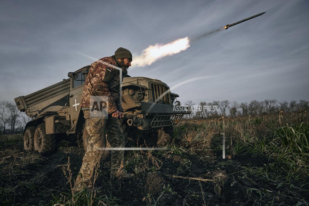 Libkos Ukrainian military's Grad multiple rocket launcher fires rockets at Russian positions in the frontline near Bakhmut, Donetsk region, Ukraine, Thursday, Nov. 24, 2022. (AP Photo/LIBKOS)