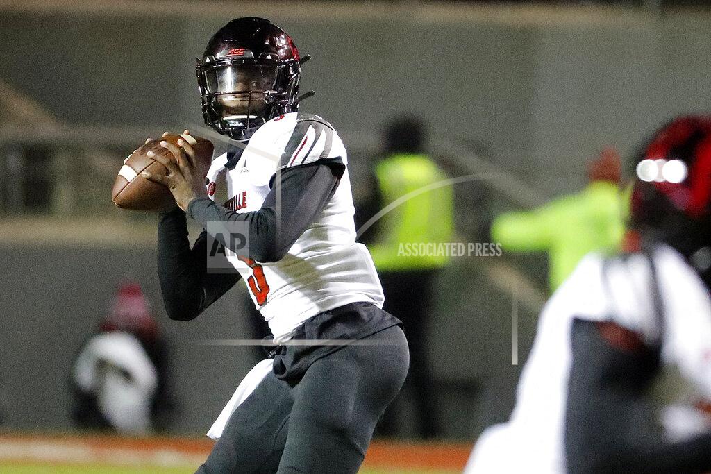 Karl B Deblaker Louisville's Micale Cunningham looks for a receiver during the first half of the team's NCAA college football game against North Carolina State in Raleigh, N.C., Saturday, Nov. 16, 2019. (AP Photo/Karl B DeBlaker)