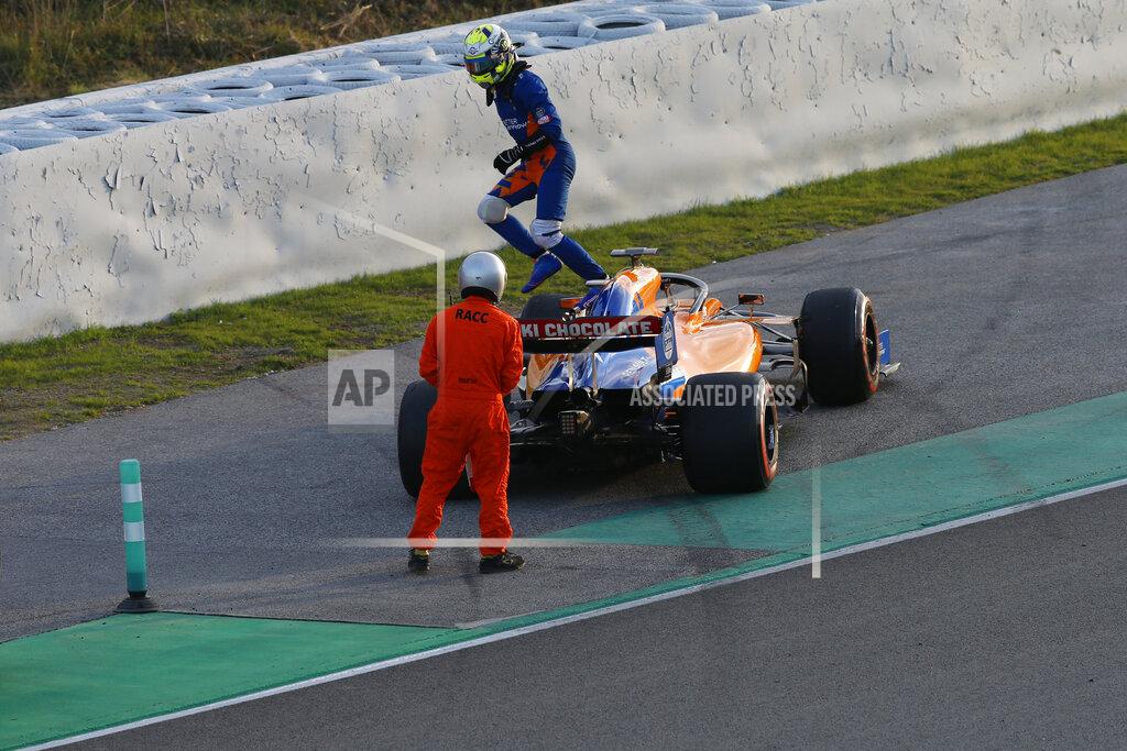 Joan Monfort McLaren driver Lando Norris of Britain jumps from his car on the side of the track during a Formula One pre-season testing session at the Catalunya racetrack in Montmelo, outside Barcelona, Spain, Tuesday, Feb. 26, 2019. (AP Photo/Joan Monfort)