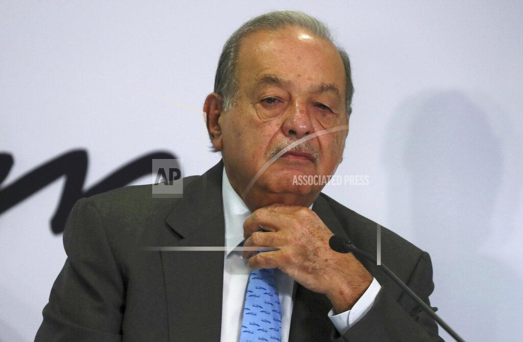 Fernando Llano FILE - In this Oct. 16, 2019 file photo, Mexican billionaire Carlos Slim listens to a question during a news conference at his office in Mexico City. Slim’s son said on Monday, Jan. 25, 2021, that his father has become infected with COVID-19 but that his symptoms are minor. (AP Photo/Fernando Llano, File)