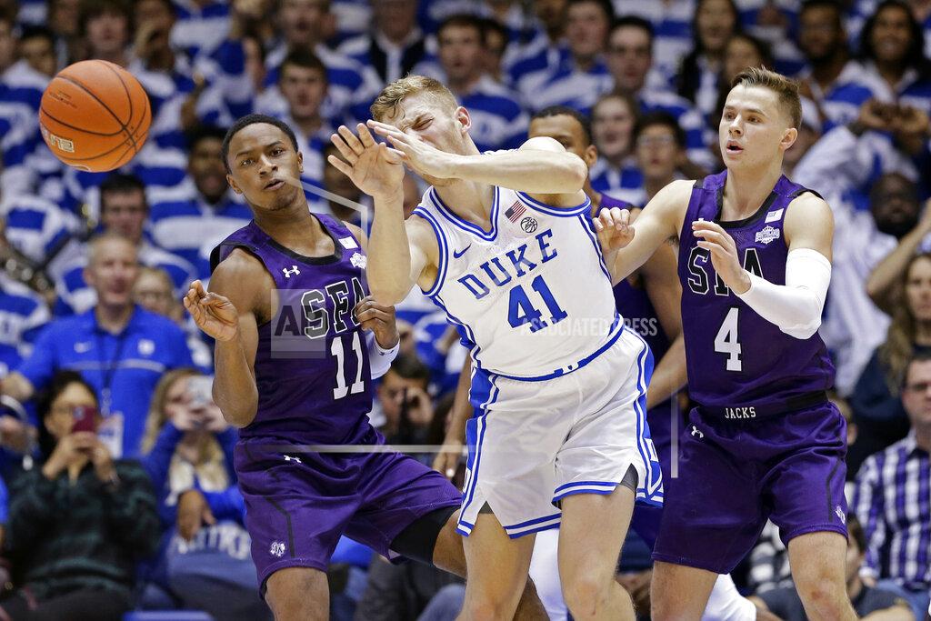 Gerry Broome Stephen F. Austin guard Oddyst Walker (11) and guard David Kachelries (4) pressure Duke forward Jack White (41) during the first half of an NCAA college basketball game in Durham, N.C., Tuesday, Nov. 26, 2019. (AP Photo/Gerry Broome)