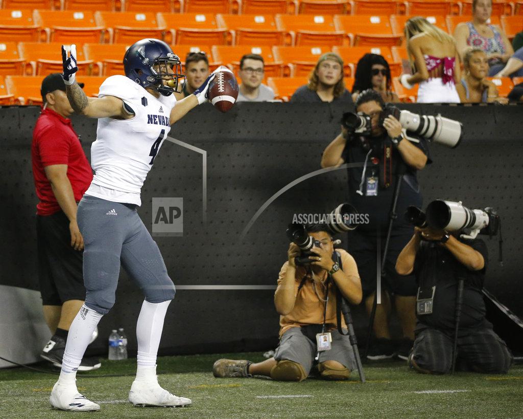 Marco Garcia Nevada wide receiver Elijah Cooks (4) reacts after making a touchdown against Hawaii during the first half of an NCAA college football game Saturday, Oct. 20, 2018, in Honolulu. (AP Photo/Marco Garcia)