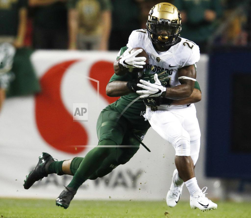 David Zalubowski Colorado State linebacker Josh Watson, left, tackles Colorado running back Kyle Evans after a short gain in the first half of an NCAA college football game Friday, Aug. 31, 2018, in Denver. (AP Photo/David Zalubowski)
