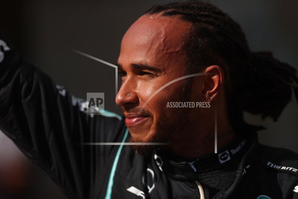 Lars Baron Mercedes driver Lewis Hamilton, of Britain, waves at the fans after coming in first in the Brazilian Formula One Grand Prix in Sao Paulo, Brazil, Sunday, Nov. 14, 2021. (Lars Baron, Pool Photo via AP)
