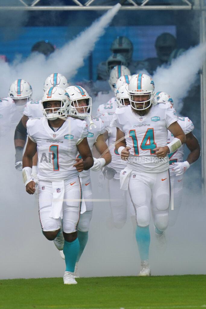 Lynne Sladky Miami Dolphins quarterbacks Tua Tagovailoa (1) and quarterback Ryan Fitzpatrick (14) enter the field, during the first half of an NFL football game against the Los Angeles Rams, Sunday, Nov. 1, 2020, in Miami Gardens, Fla. This is quarterback Tua Tagovailoa's first game as the starting quarterback. (AP Photo/Lynne Sladky)