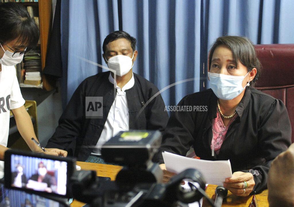 Aung Shine Oo Min Min Soe, right, and Thae Maung Maung, left rear, both lawyers assigned by the National League for Democracy party to represent deposed Myanmar leader Aung San Suu Kyi, meet journalists in Naypyitaw, Myanmar, Monday, June 21, 2021. As the trial of ousted leader Aung San Suu Kyi entered its second week, her lawyers said prosecution witnesses testified about charges that she had illegally imported and used walkie-talkies for her bodyguards, and along with Win Myint, president in her government, had flouted laws on public gatherings that were meant to combat the spread of COVID-19. (AP Photo)