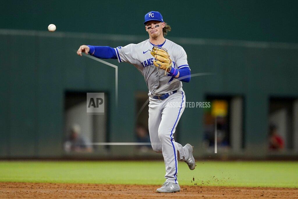 Tony Gutierrez RETRANSMISSION TO CORRECT POSITION TO SHORTSTOP - Kansas City Royals shortstop Bobby Witt Jr. throws to first to complete the ground out by Texas Rangers' Adolis Garcia in the third inning of a baseball game, Tuesday, May 10, 2022, in Arlington, Texas. (AP Photo/Tony Gutierrez)