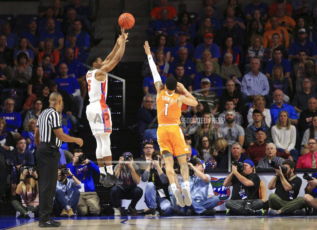 Matt Stamey Florida guard KeVaughn Allen (5) makes a 3-point shot over Tennessee guard Lamonte Turner (1) during the first half of an NCAA college basketball game Saturday, Jan. 12, 2019, in Gainesville, Fla. (AP Photo/Matt Stamey)