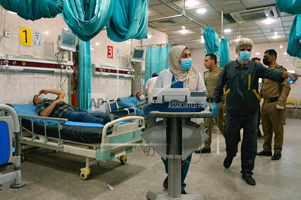 Hadi Mizban People with breathing problems are treated at a hospital during a sandstorm in Baghdad, Iraq, Monday, May 23, 2022. (AP Photo/Hadi Mizban)
