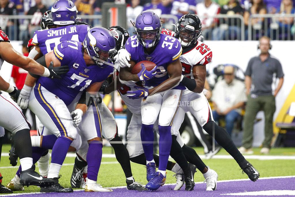 Bruce Kluckhohn Minnesota Vikings running back Dalvin Cook (33) scores on a 7-yard touchdown run ahead of Atlanta Falcons strong safety Keanu Neal (22) during the second half of an NFL football game, Sunday, Sept. 8, 2019, in Minneapolis. (AP Photo/Bruce Kluckhohn)