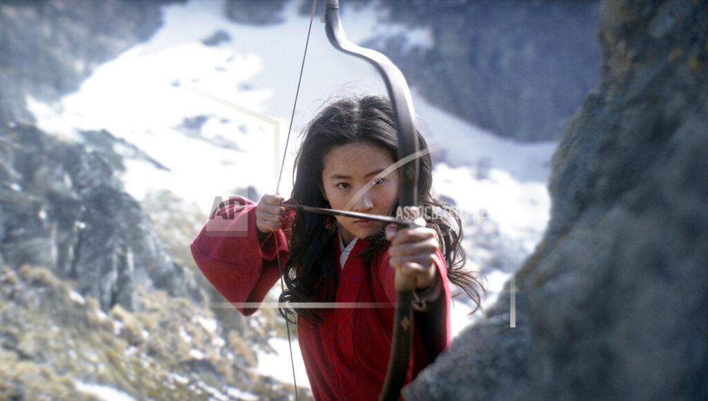 Jasin Boland This image released by Disney shows Yifei Liu in the title role of "Mulan." (Jasin Boland/Disney via AP)